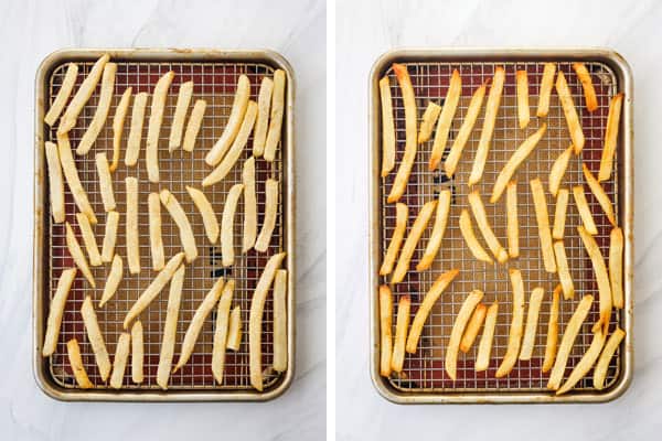 Frozen and cooked fries on a rack inside a sheet pan.