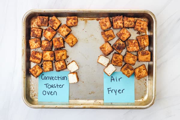 Crispy baked and air fried tofu pieces on a sheet pan.