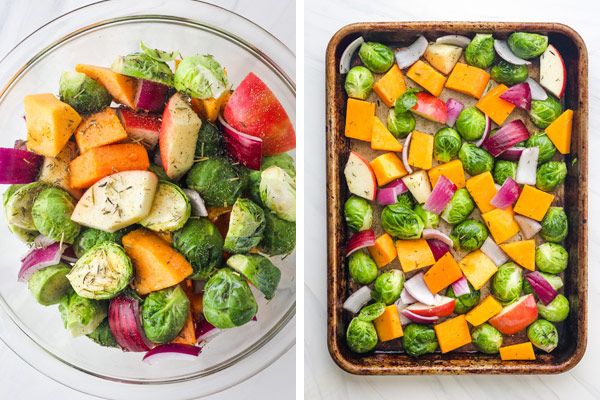 A glass bowl of chopped vegetables and a sheet pan with chopped Brussels sprouts, squash, onion, and apple.