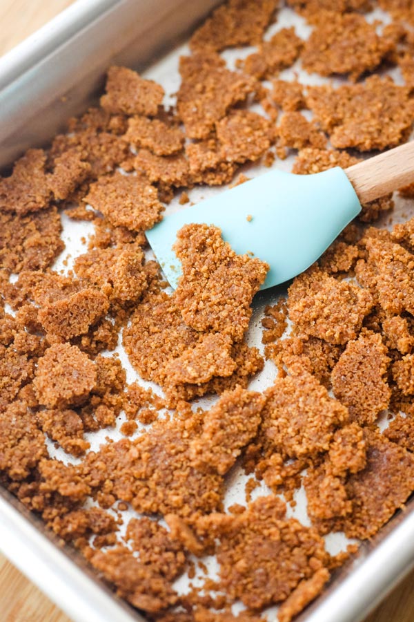 Baked crumble chunks on a small sheet pan.