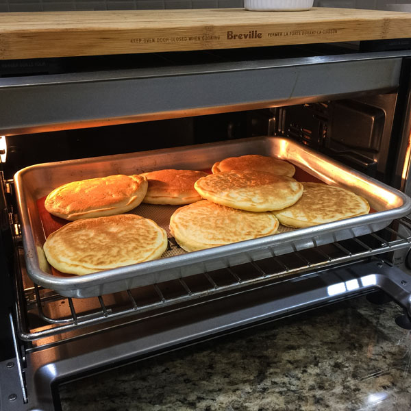 A pan of pancakes inside a toaster oven.