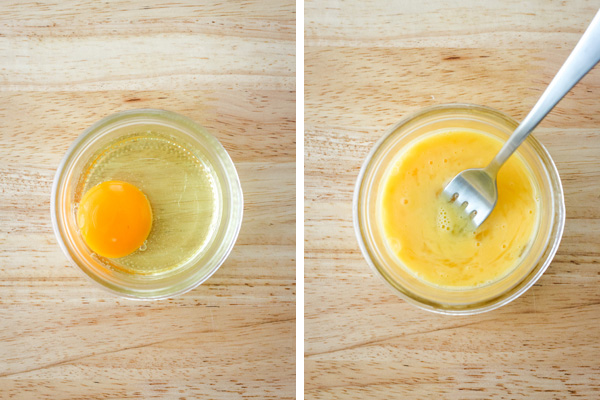 Large egg in a small mason jar, whole and beaten with a fork.