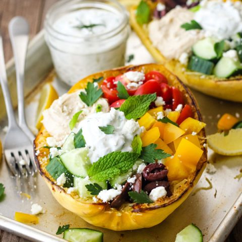 Stuffed spaghetti squash on a sheet pan.