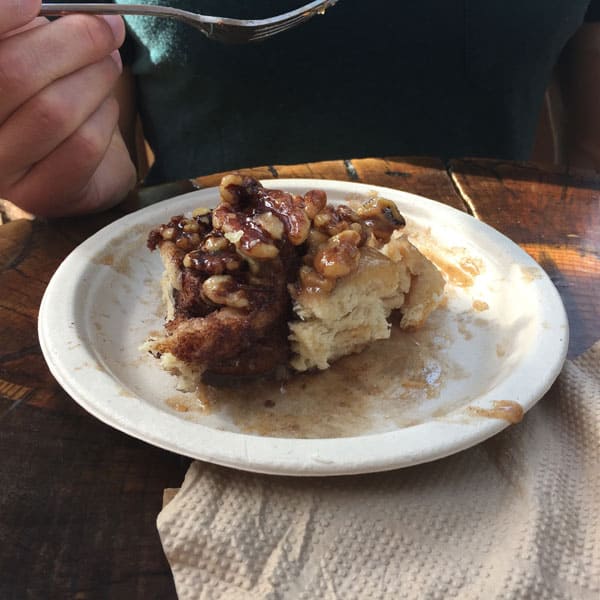 Interior of a sticky bun on a white plate.