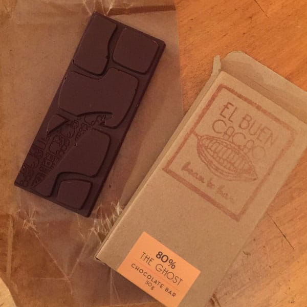 Chocolate Ghost Bar next to packaging on a table.
