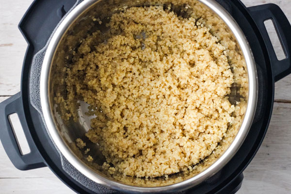 Fluffed quinoa inside a 3 quart Instant Pot. 