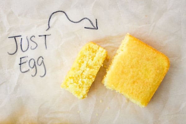 Fluffy slices of lemon cake with text Just Egg.