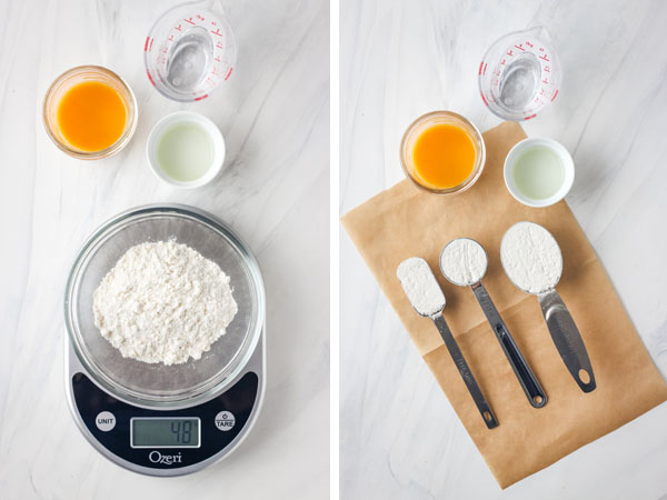 Cake mix measured in a bowl on a scale and using measuring spoons.