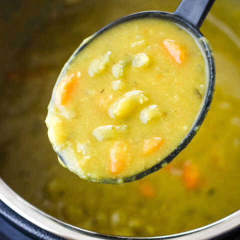 Spoon scooping soup out of an instant pot.