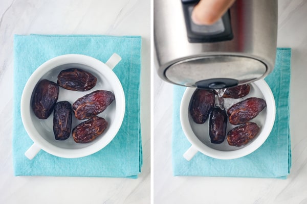 Dried dates in a small dish with boiling water poured over them.