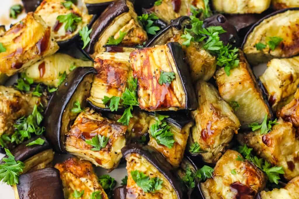 Cooked eggplant with balsamic vinegar and parsley.