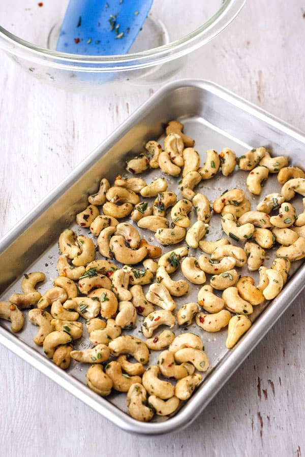 Rosemary Cashews on a greased 1/8 metal sheet pan.