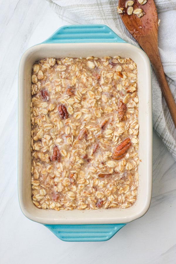 Banana oatmeal mixture in a small blue baking dish.