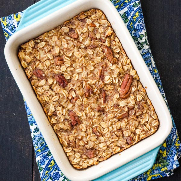 Baked oatmeal in a blue 7x5-inch baking dish.