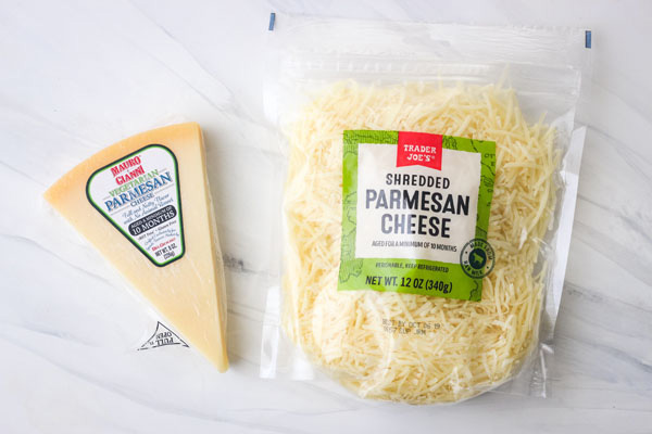 Bag and wedge of vegetarian parmesan cheese.