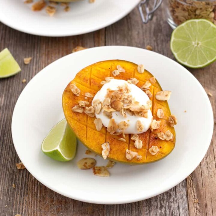 Sweet and spicy broiled mango topped with Greek yogurt and granola.