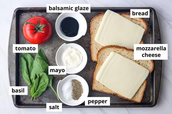 Ingredients arranged on a sheet pan with labels.