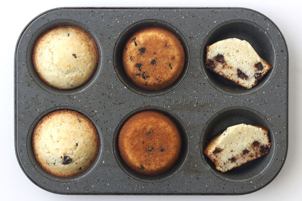 Photo of muffins baked in a metal muffin tin showing top and bottom browning.