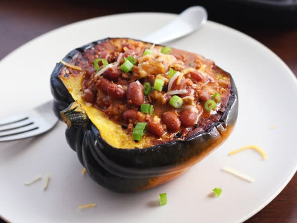 cooked acorn squash bowl filled with vegetarian chili