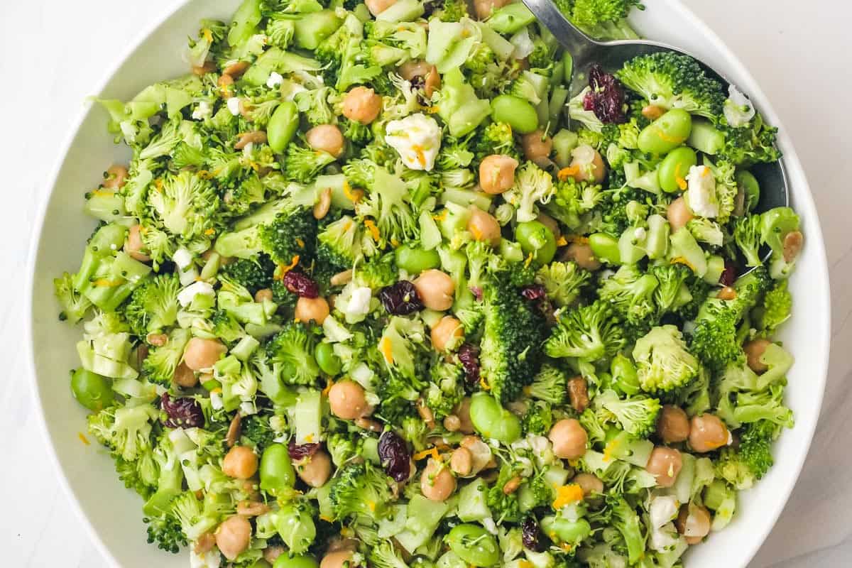 Overhead view of chopped broccoli salad in a large bowl.