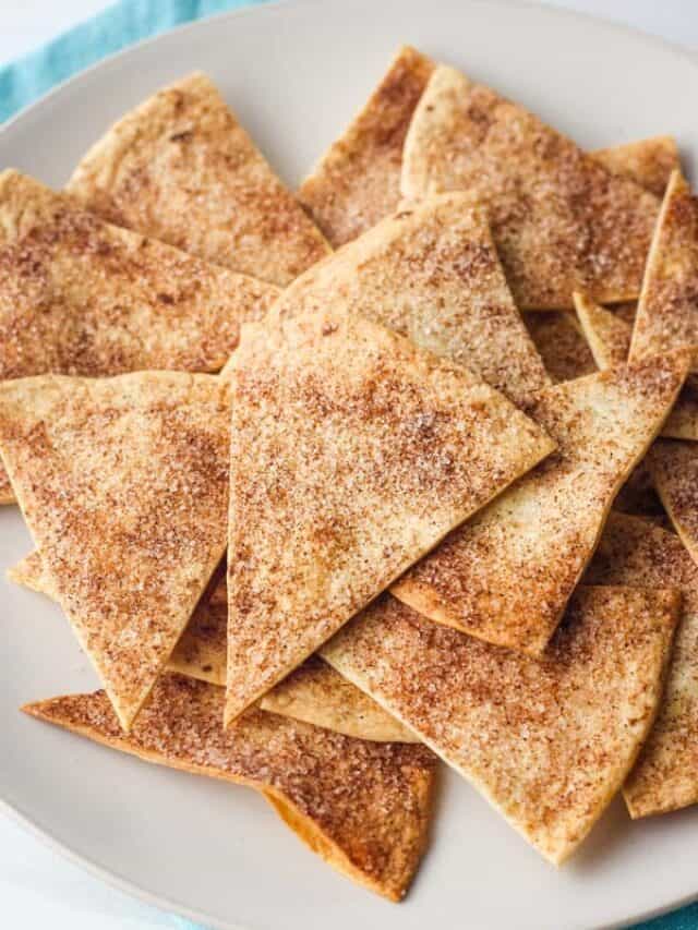 Cinnamon sugar chips on plate with blue napkin.