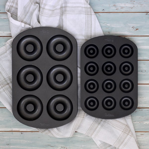 A mini donut pan and a large six-cavity donut pan