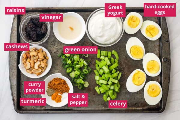 Recipe ingredients arranged on a sheet pan and labeled.