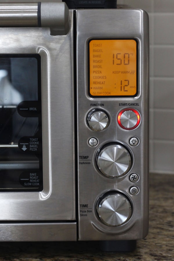 Closeup of toaster oven control panel with 150 degrees showing.