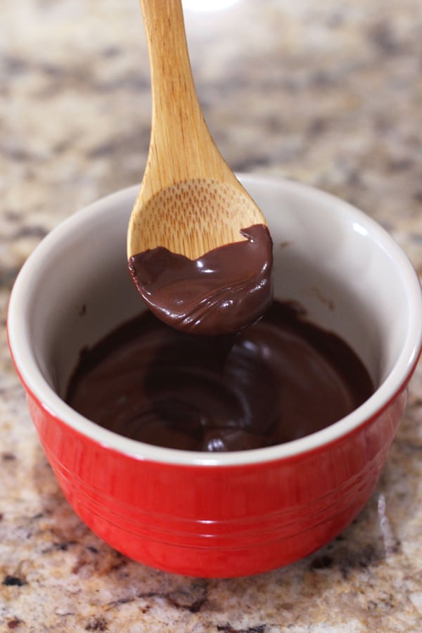 Melted milk chocolate on a spoon