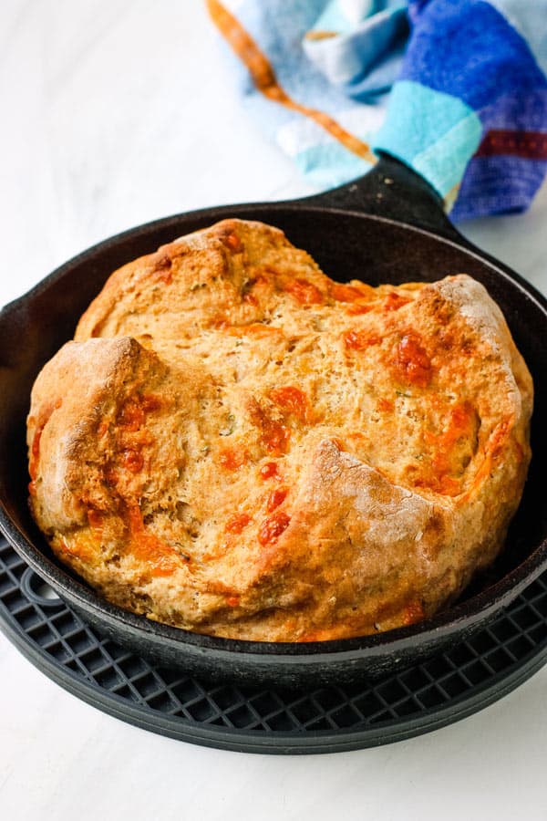 Closeup of mini soda bread baked in a small cast iron pan.