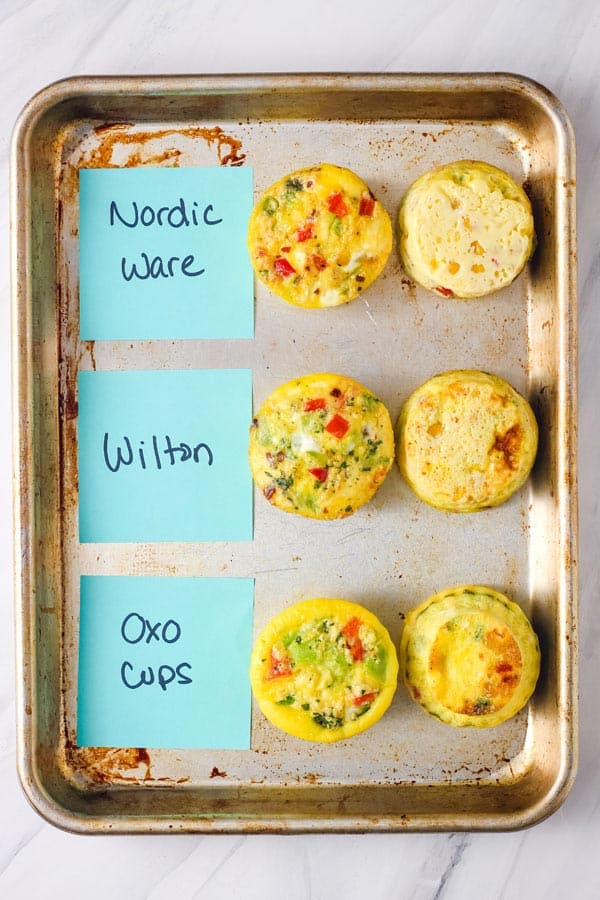 Sets of egg muffins labeled on a sheet pan.