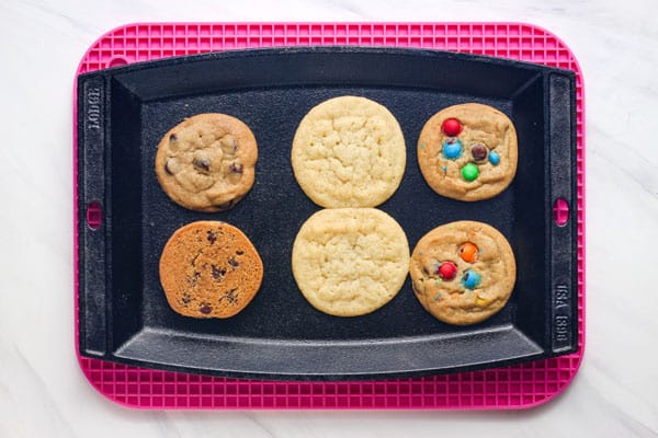 Overhead view of cookies baked on a small cast iron griddle.