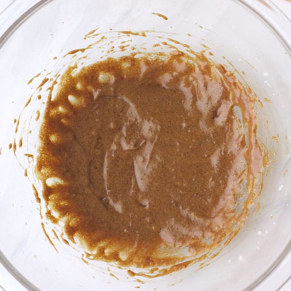Overhead view of sticky batter in a mixing bowl.