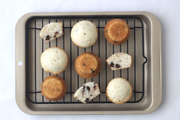 Mini muffins baked in a toaster oven on a cooking rack.