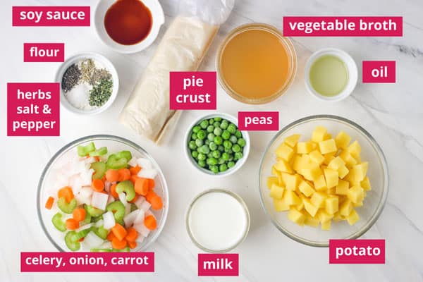 Bowls and ramekins of ingredients arranged on a table with labels.