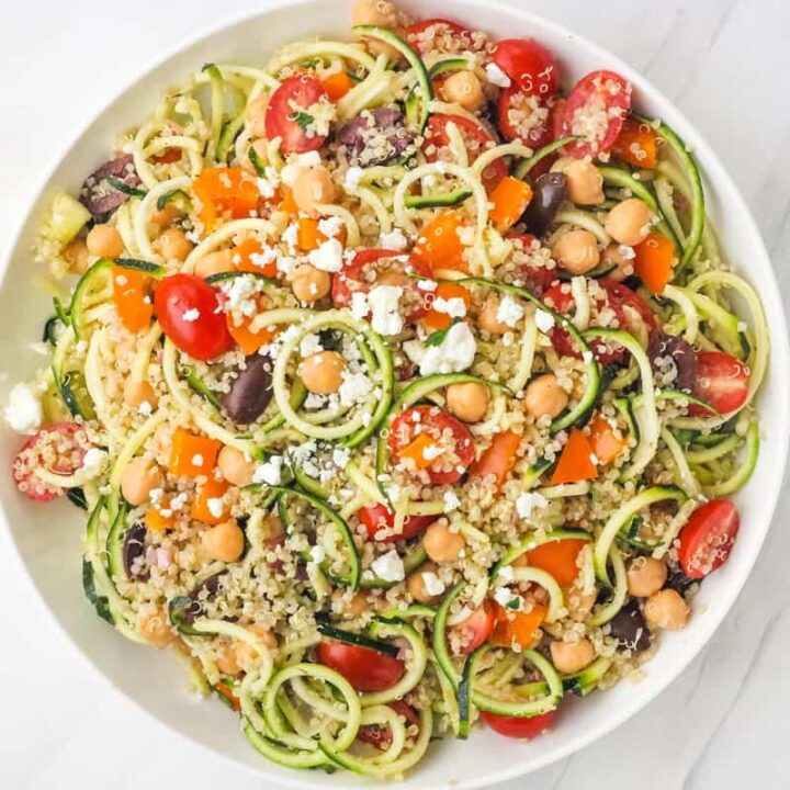 Large bowl of chickpea, quinoa, and zucchini noodles.