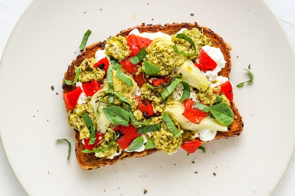 Chopped red pepper and pesto on toast.