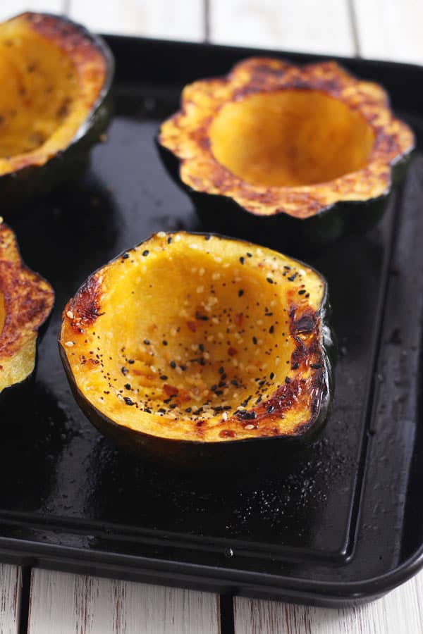 roasted acorn squash bowls on a toaster oven baking pan