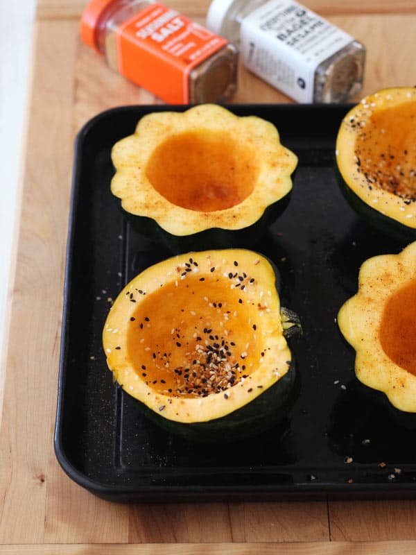 seasoned acorn squash on a toaster oven baking pan