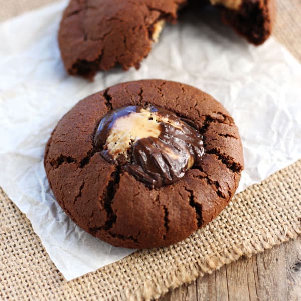 Chocolate cookie with a melty mini peanut butter cup pressed into the top.