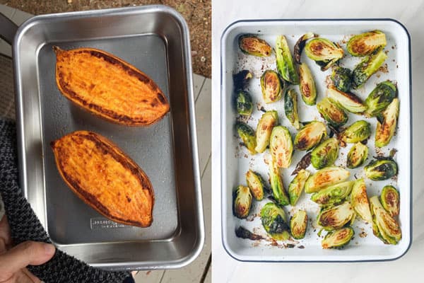 Sheet pans with cooked sweet potato halves and Brussels sprouts.