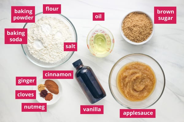 Bowls and ramekins of ingredients labeled on a counter.