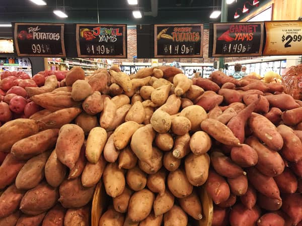 Sweet potato varieties at a grocery store.