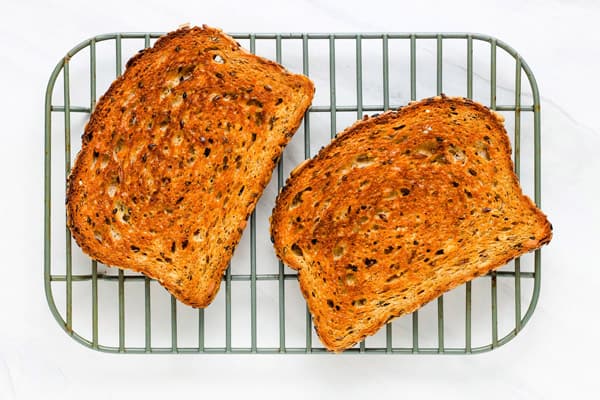 Toasted bread cooling on a rack.