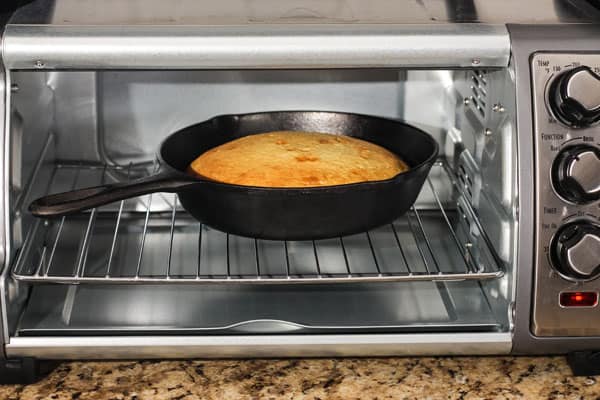 Cast iron pan inside of a toaster oven.