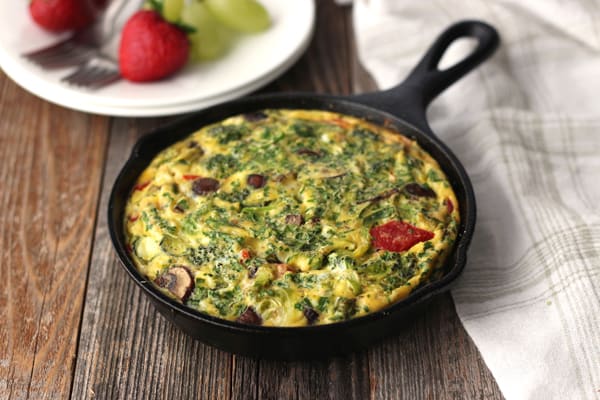 Frittata baked in a mini cast iron skillet on a wooden table 