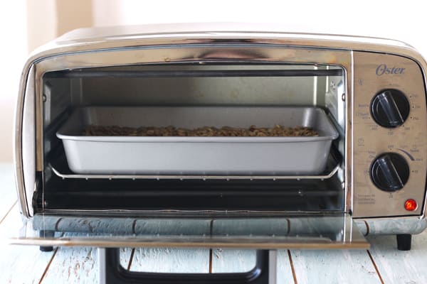 Granola cooking in a small toaster oven