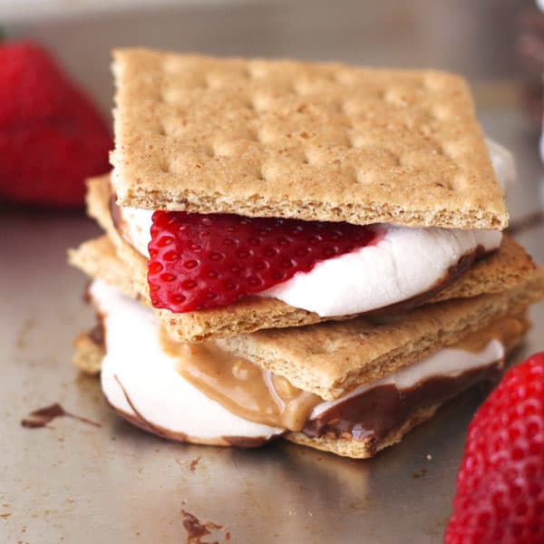 Toaster oven s'mores with fresh strawberry slices and peanut butter.