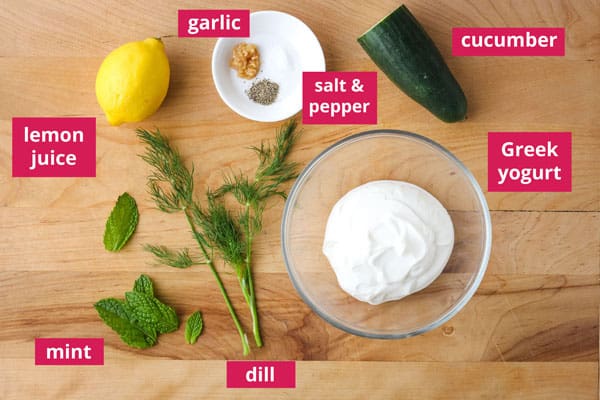 Recipe ingredients labeled and arranged on a cutting board.