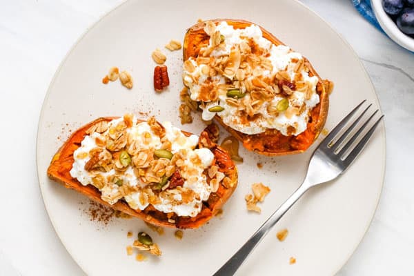 Plate with stuffed sweet potatoes and a fork.